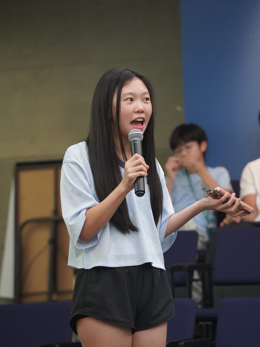A student presenting her product on demo day