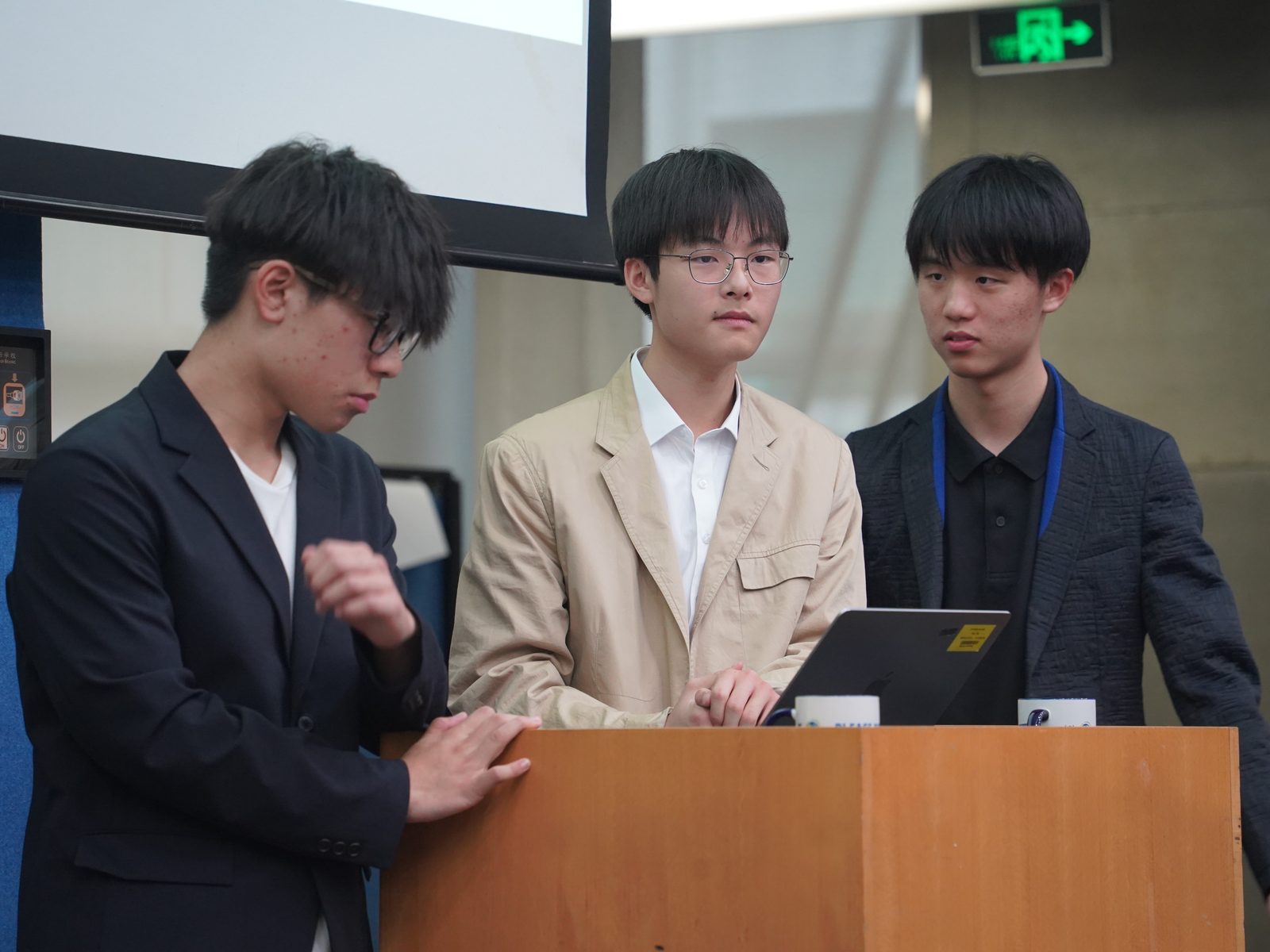 A team at the podium during the final pitch