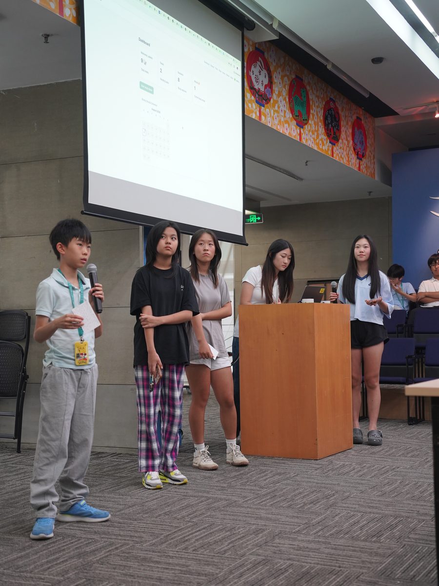 A student team on stage for the final pitch